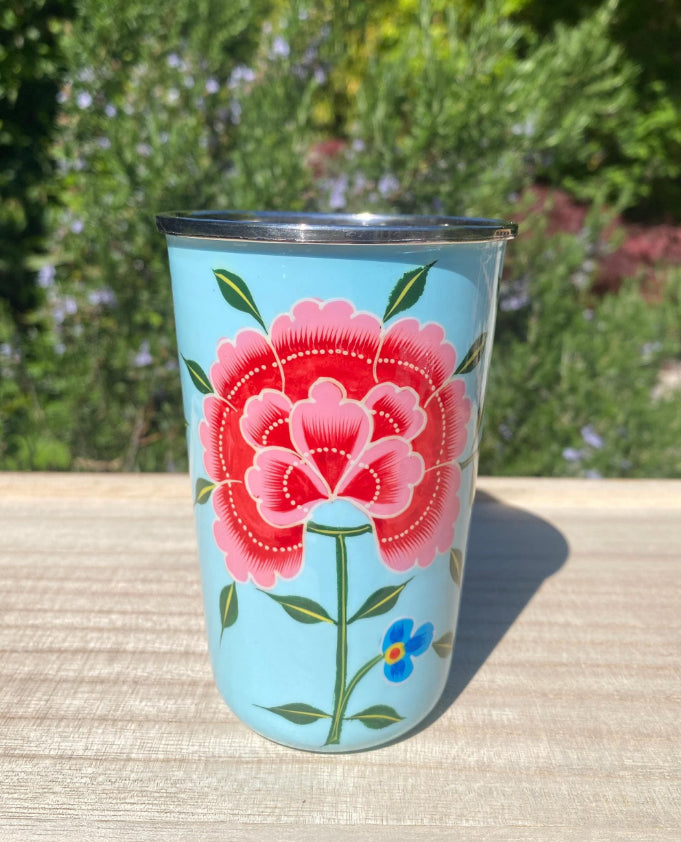 pale blue tumbler with a pink floral design