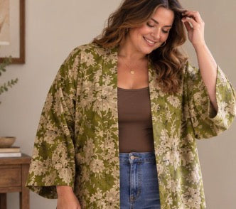 Plus size model wearing olive green kimono jacket