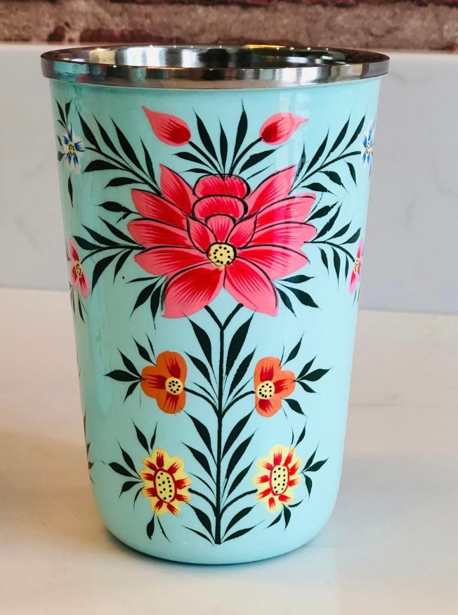 pale green umbler with red flower.  Enamel outer and stainless steel inside