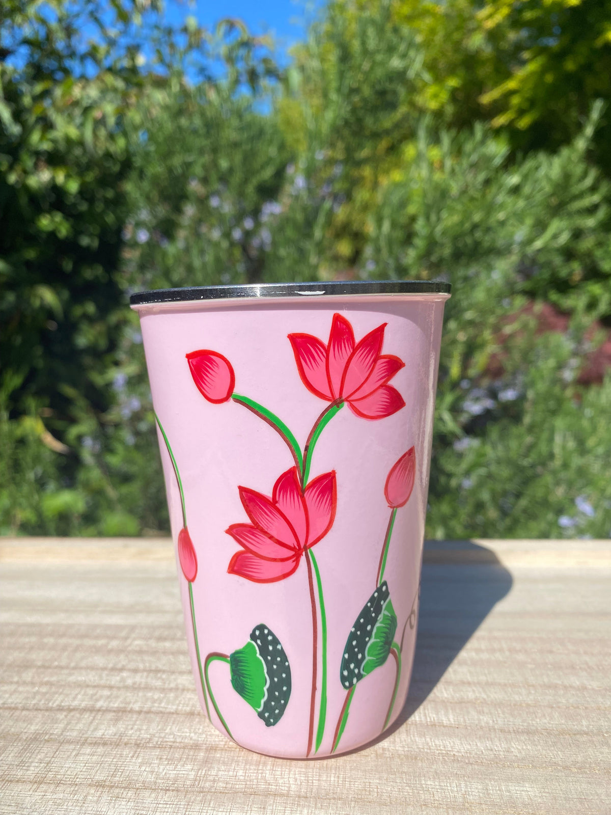 pale pink tumbler with lotus flower.  Enamel outer and stainless steel inside
