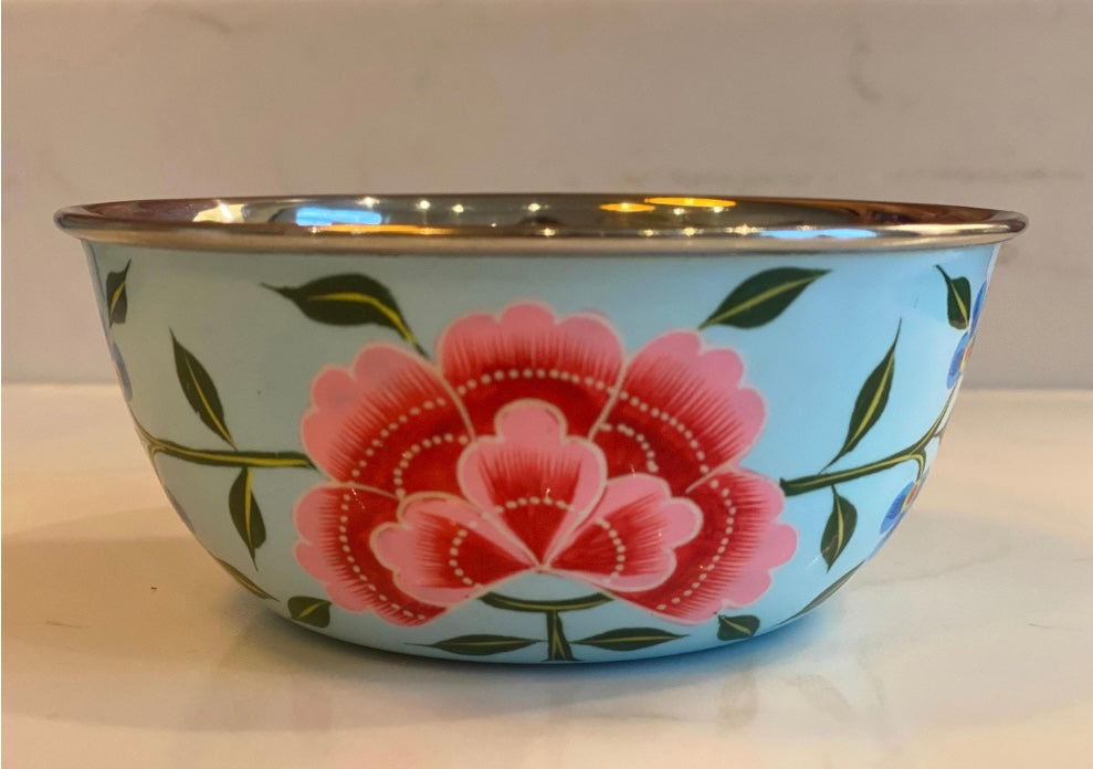 Floral-patterned bowl on a white surface with a light gray background