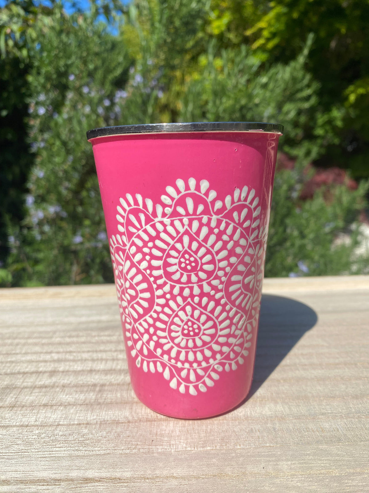 bright pink tumbler with mandala pattern.  Enamel outer and stainless steel inside