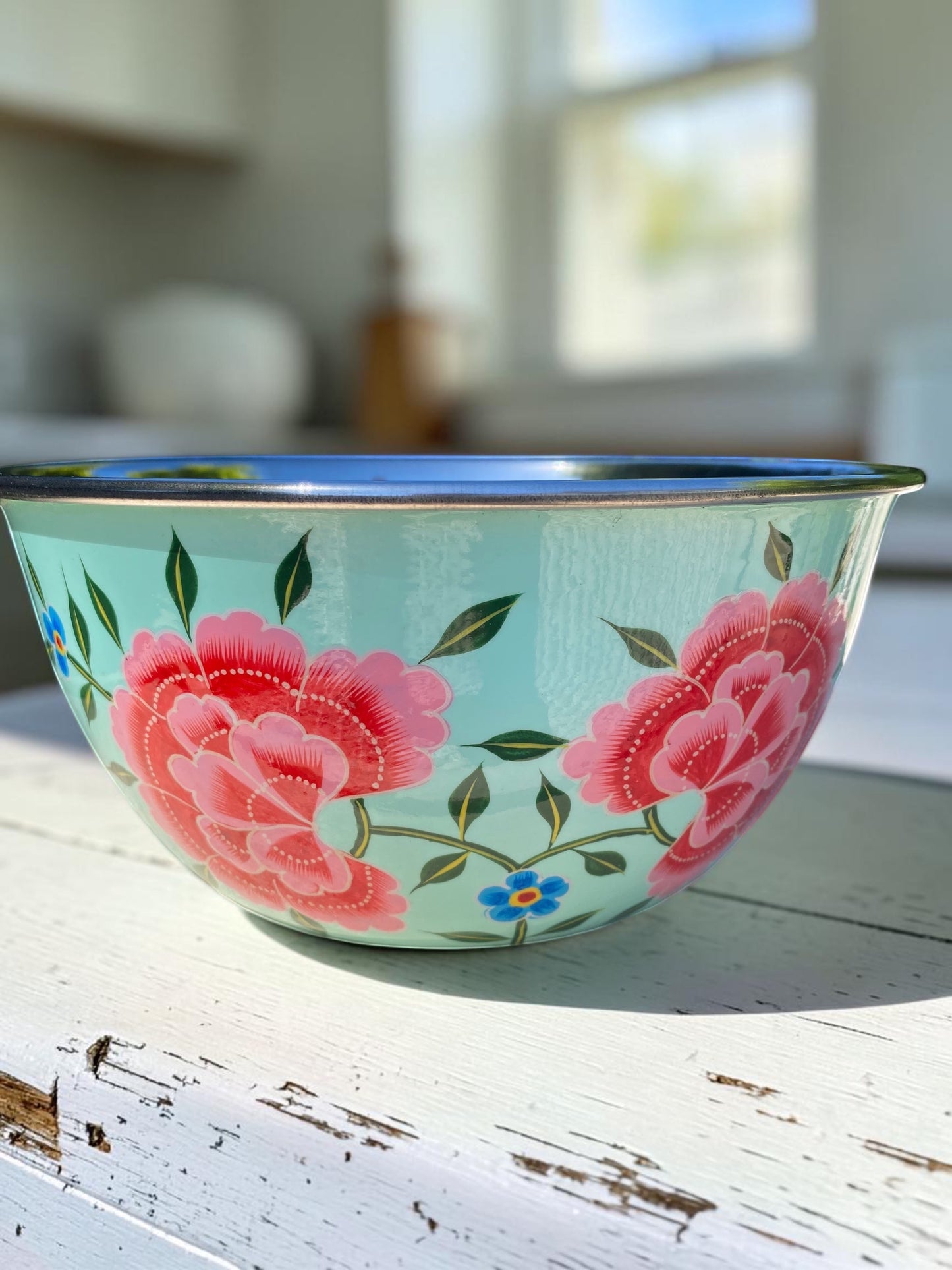 The Bamboo Bird hand-painted stainless steel and enamel bowl in light blue with floral peony design