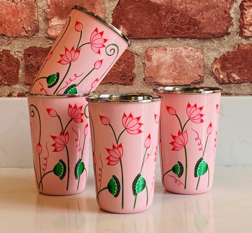 The Bamboo Bird set of four pink stainless steel tumblers hand-painted with floral lotus designs in Kashmir.