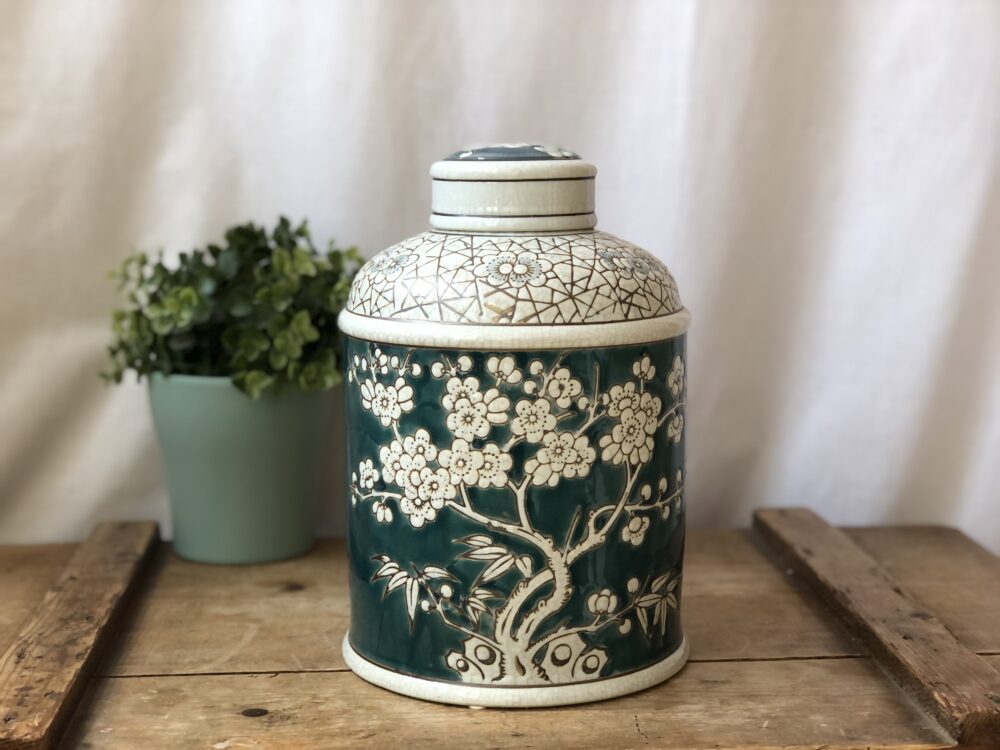 *teal and white ginger jar with blossom