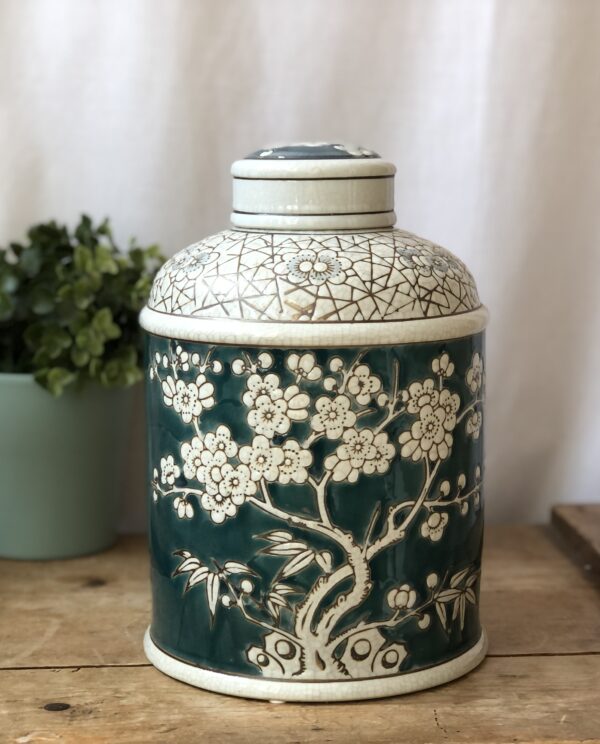 *teal and white ginger jar with blossom