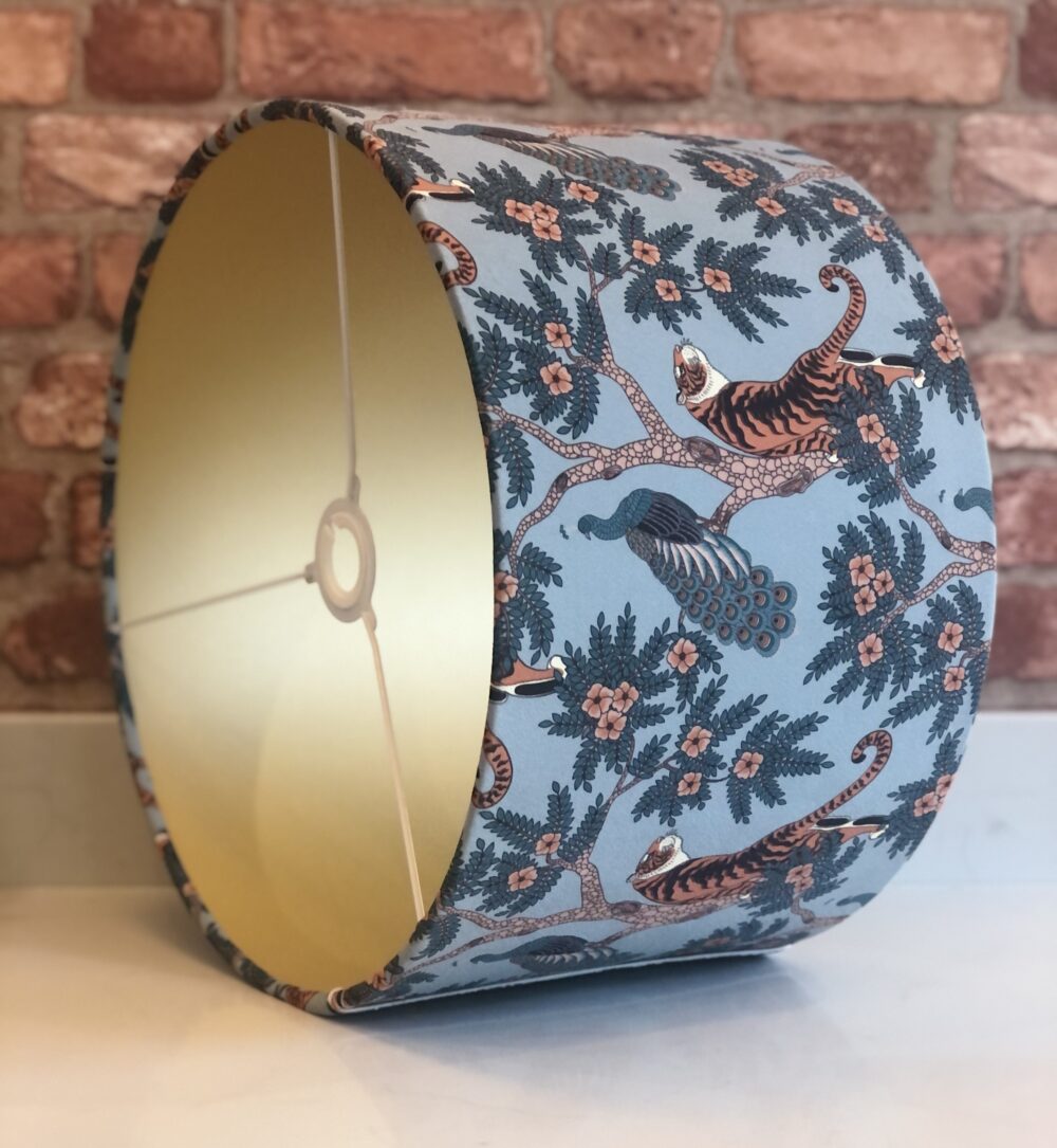 * pale blue tiger peacock lampshade with gold lining